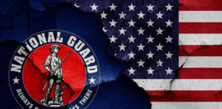 National Guard logo over a distressed American flag