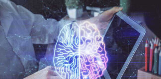 Futuristic AI brain hologram above a laptop computer