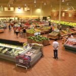 Heart Health SHOCK: Convenience Foods Can Help! Interior of a grocery store filled with fresh produce and shoppers