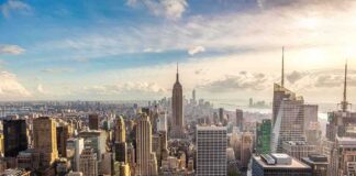 Aerial view of New York City skyline featuring the Empire State Building at sunset