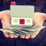 Ditch Infinite Growth: Redefine the American Dream Now! Hands holding a small house model and cash bills