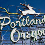 Portland, Oregon neon sign with leaping deer outline