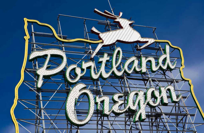 Portland, Oregon neon sign with leaping deer outline