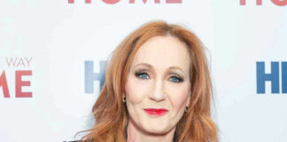 Woman with red hair smiling at an event