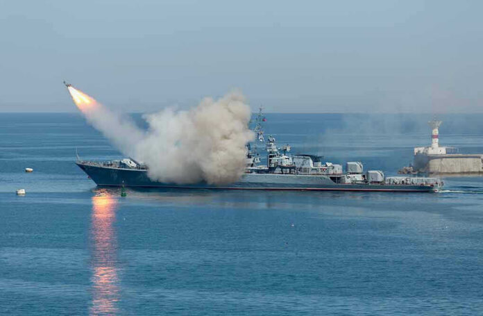 Warship firing missile in the sea