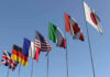 Oh No: Italian Pasta Going Bye-Bye? Flags of seven countries against clear blue sky.
