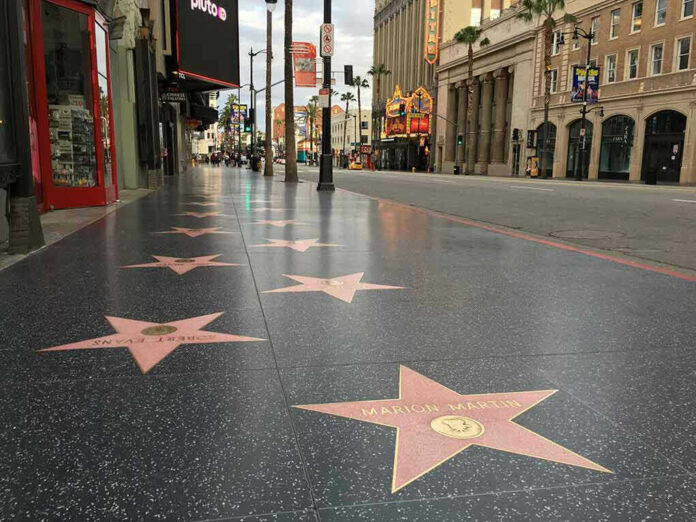 1681128400 Hollywood Walk of Fame stars on sidewalk