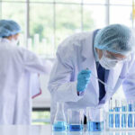 Scientists working in a laboratory with test tubes