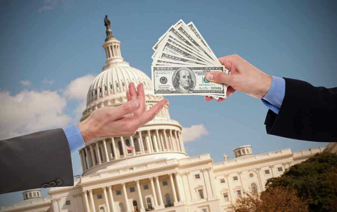 192890837 Hands exchanging money in front of Capitol building.