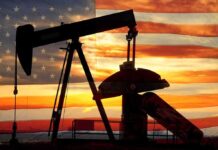 U.S. Grabs Venezuela Oil — Massive Market Shift Silhouette of an oil pump jack against a sunset background with an American flag overlay