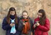 Roblox’s Predator Protection Scandal Three teenagers using smartphones while standing against a textured wall