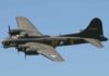 Boeing B-17 flying against a clear blue sky