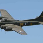 Boeing B-17 flying against a clear blue sky