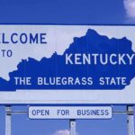 Kentucky’s Cancer Crisis — Devastating 512 Cases Surge! Welcome sign for Kentucky, the Bluegrass State, with a blue background