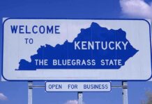 Kentucky’s Cancer Crisis — Devastating 512 Cases Surge! Welcome sign for Kentucky, the Bluegrass State, with a blue background