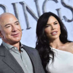 Two people posing at an event.