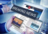 Breaking news on a digital tablet screen.