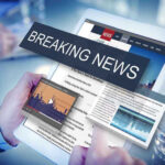 Breaking news on a digital tablet screen.