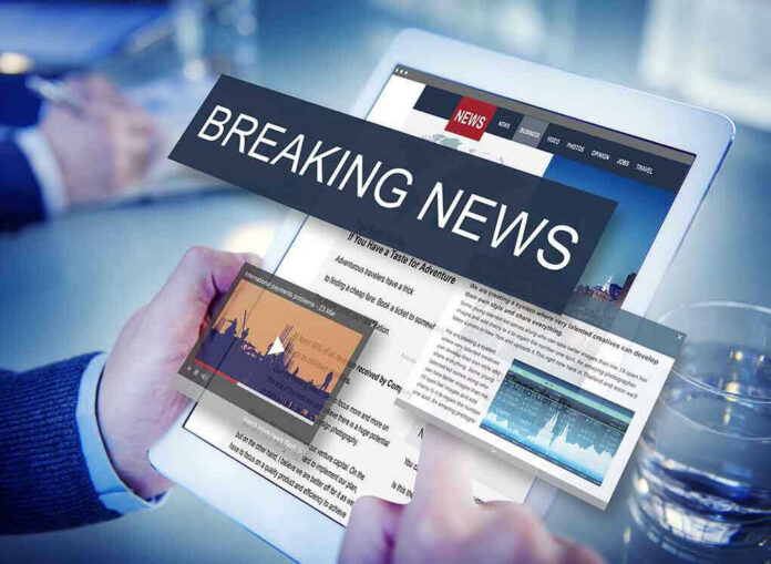 Breaking news on a digital tablet screen.