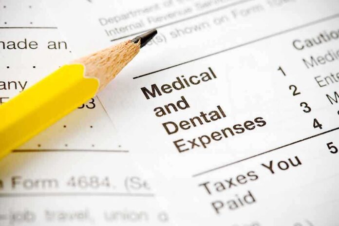 Close-up of tax document with medical and dental expenses section and a yellow pencil
