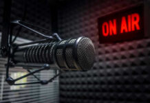 Chinese Cash FUELS U.S. Politics – Shocking Links Microphone in soundproof studio with On Air sign.