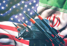 Missiles in front of American and Iranian flags.