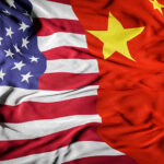 SHOCKING: California Mayor’s Secret Ties to China! United States flag merged with China flag.
