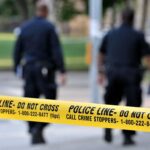 Seattle Streets Turn BATTLE ZONE – Kids at Risk Police officers walking past caution tape at a crime scene