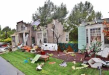 Excavator Rampage: Marriage Ends in Chaos! Houses with significant storm damage and debris scattered around the yard