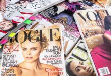A collection of Vogue magazines featuring various covers and celebrity portraits