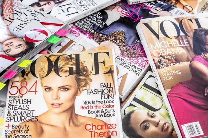 shutterstock_1707148741 A collection of Vogue magazines featuring various covers and celebrity portraits