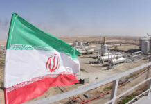 White House Boasts — Tehran Denies Iranian flag near an industrial gas refinery.