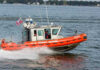 Caribbean Chase Exposes Massive Cocaine Haul Coast Guard boat speeding on the water.