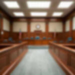 6–3 Ruling Supercharges Trump On Immigration Empty courthouse courtroom with wooden benches and chairs.