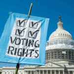 Byron Donalds Torches ‘Lazy’ Senate- ‘The Senate Sucks’ Sign reading Voting Rights in front of Capitol building.