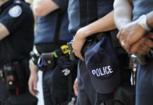 Texas Chaos: 11 Shot, Alerts Spark Fury Group of police officers in uniform standing together with a police cap visible
