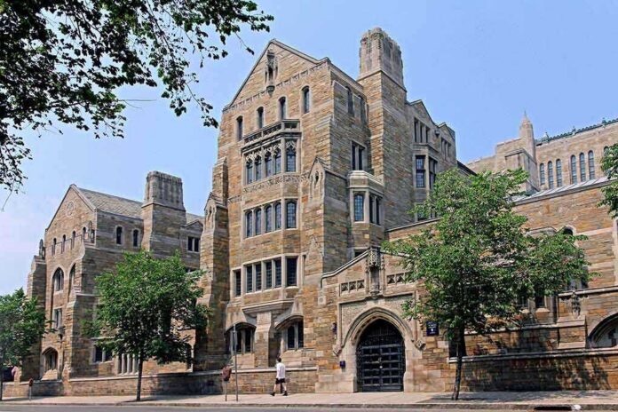 shutterstock_127916003 Historic university building with stone facade and surrounding trees