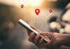 Supreme Court Smacks Geofence Dragnets Person using a smartphone with location markers displayed on the screen