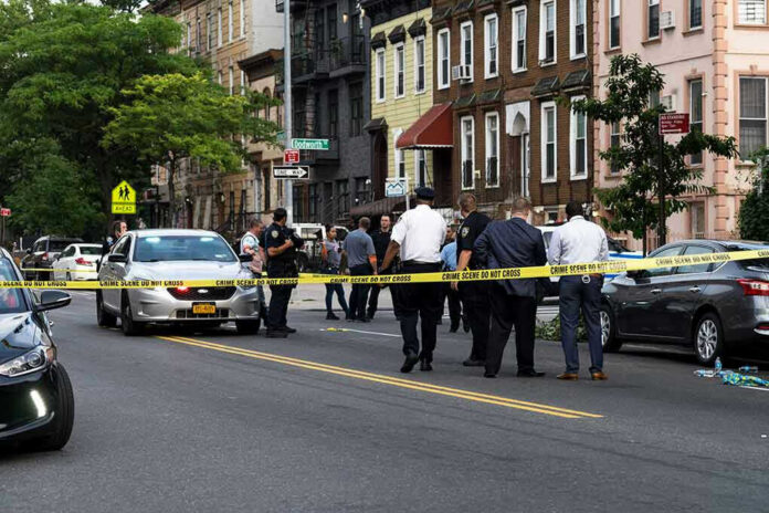 1437619223-1 Police gathered at an urban crime scene.