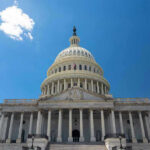 Grieving Moms vs. Grandstanding Politicians U.S. Capitol building against a clear blue sky.
