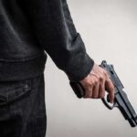 Cartel-Style Hit Stuns Mayor’s Office person holding a handgun at their side