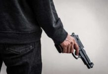 Cartel-Style Hit Stuns Mayor’s Office person holding a handgun at their side