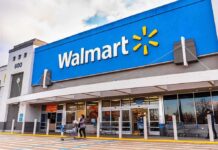 Exterior view of a Walmart store with customers entering