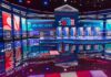 Common Sense vs. Communism Showdown Televised debate stage with multiple podiums and bright red, white, and blue lighting