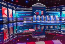 Common Sense vs. Communism Showdown Televised debate stage with multiple podiums and bright red, white, and blue lighting