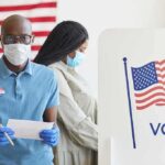 Historic Flip: Democrats Hit Rock Bottom Voters wearing masks at a polling station
