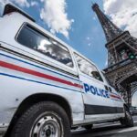 Three Women Down—Paris On Edge Police van near the Eiffel Tower