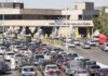 Asylum Bet Backfires Big Border inspection station with heavy vehicle traffic