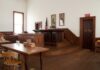 Censored Victims—Fifth Circuit Showdown Looms Interior of a historic courtroom with wooden furniture and an American flag