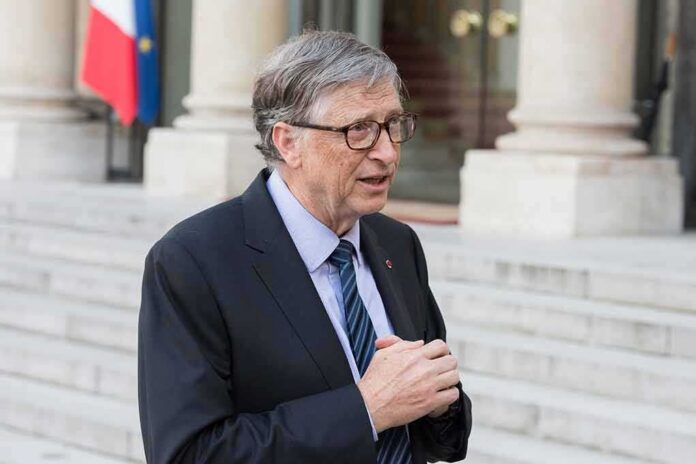 shutterstock_1070620826 older man in suit speaking outside a building